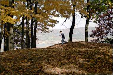 A boy plays in Effigy Mounds National Monument.