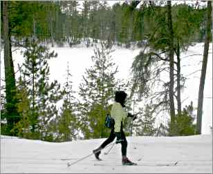 A skier passes Norberg Lake in Bear Head Lake State Park.