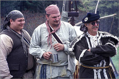 Three voyageurs at the North West Co. fur post.