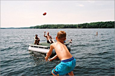 Playing ball on the lake.