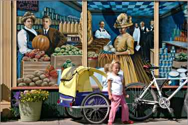 Child in front of Ashland co-op mural