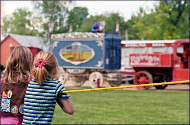 Girls watch a parade at Circus World.