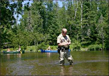 A warden on the Bois Brule River.