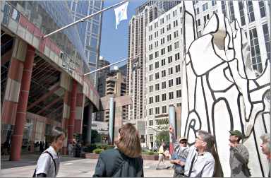 Tourists look at Chicago architecture.