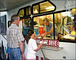 Buying funnel cakes in Clear Lake.