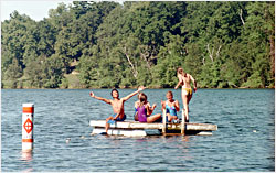 A family gathers on a raft.