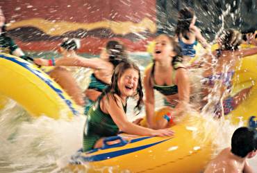 Children ride tubes at an indoor water park in the Wisconsin