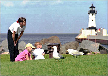 Kids talk to gulls on Duluth's Canal Park.