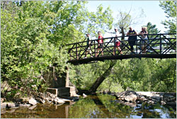 Hikers cross Miller Creek in Duluth.