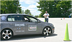 A teacher checks a slalom time.