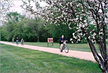 Bicyclists pedal on Wisconsin's Elroy-Sparta State Trail.