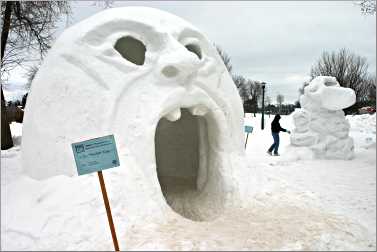 A yawning mouth is made of snow in Ely's Whiteside Park.