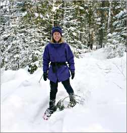 A snowshoer in woods of Bear Head Lake State Park near Ely.