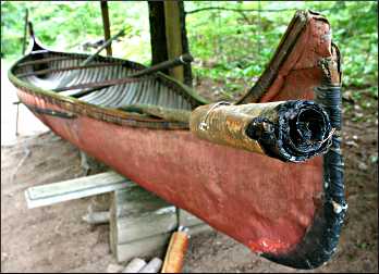 A birchbark torch and canoe.