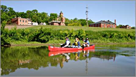 Paddlers in canoe see Galena from river.