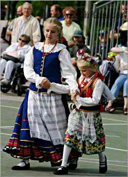 Girls in traditional clothing dancing