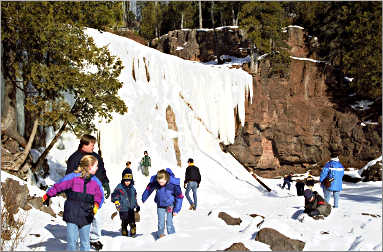Kids play on ice at Gooseberry Falls.
