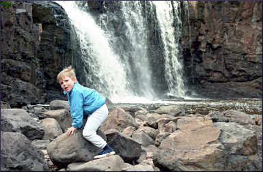 A child on the rocks at Gooseberry Falls.