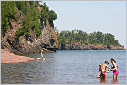 Swimmers at the mouth of the Gooseberry River.