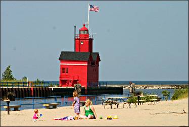 The beach and lighthouse at Holland State Park.