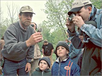 A naturalist bands a bird at the Horicon Marsh.