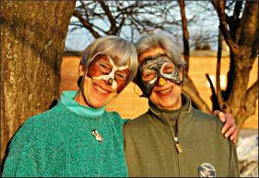Sisters with painted faces at Owl Fest.