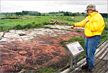 A visitor at the Jeffers Petroglyphs