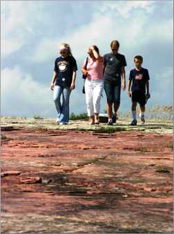 Tourists on quartzite at Jeffers Petroglyphs.