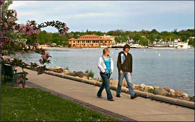 People walking around Geneva Lake.