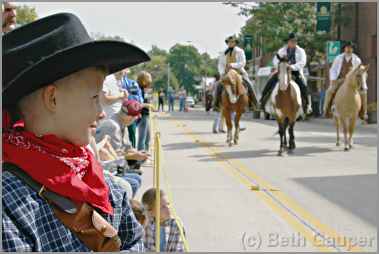 Boy watches Madelia Jesse James re-enactment.