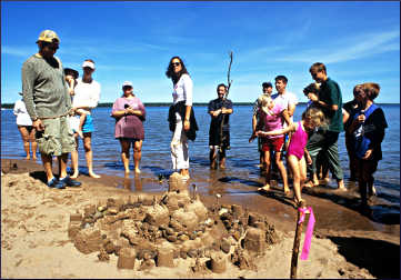 Judging a sandcastle competition.