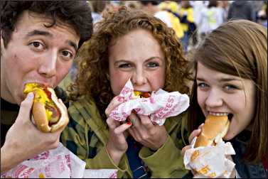 People down brats at Brat Fest.