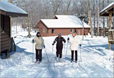 Women ski out the door at Maplelag.