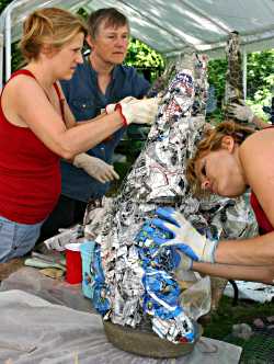 Judy Sutcliffe helps students at Shake Rag Alley.