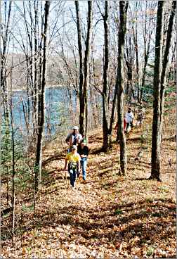 Hikers on the Mondeaux Dam esker.