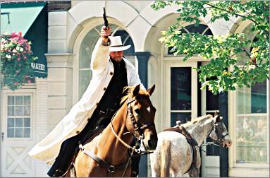 A horseman fires during Northfield's Jesse James festival.