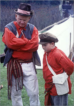 A fur-trade re-enactor and his grandson.