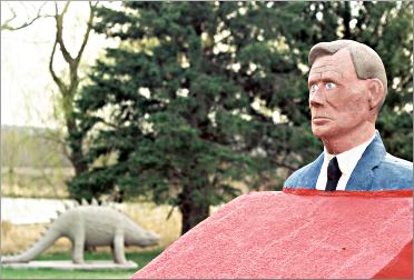 A bust of Herman Rusch looks out onto his Prairie Moon sculp