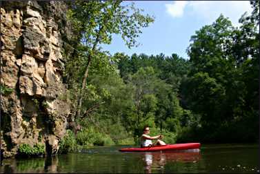 A kayaker on the Kinnickinnic River