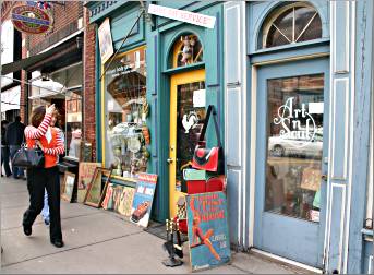 Shoppers walk along Main Street in Stillwater.