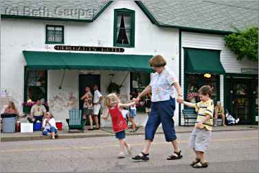 A grandmother dances with grandkids in Stockholm