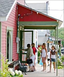 Shoppers enter a store in little Stockholm, Wis.