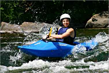 Youth learns whitewater kayaking on Wolf River.
