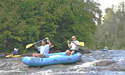 Rafters go over rapids on Wolf River.