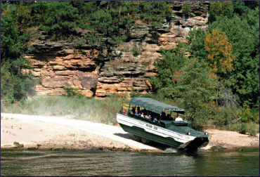 Amphibious Ducks go into the Wisconsin River.